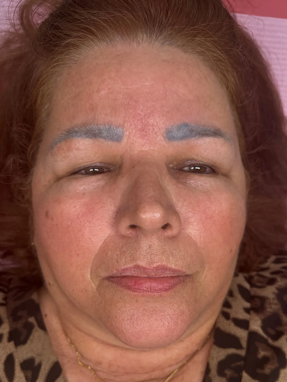 A client’s brows before correction — old microblading faded to a flat grey-blue tone